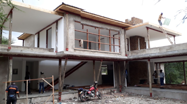 How to Build a House in Africa from Abroad